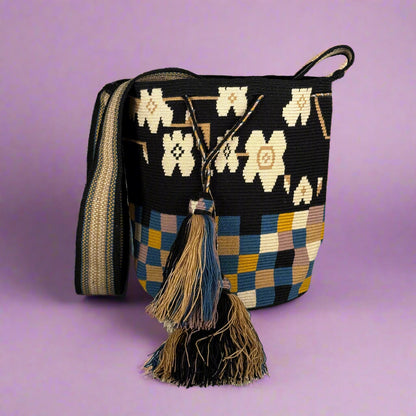 Woven bag with floral and checkered patterns on a white background