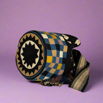 Woven bag with geometric pattern on a light gray background
